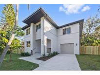 Modern two-story home with attached garage and landscaped front yard at 1919 E Hamilton Ave, Tampa, FL 33610