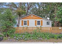 Charming renovated cottage with wood accents and picket fence at 3170 6Th S Ave, St Petersburg, FL 33712