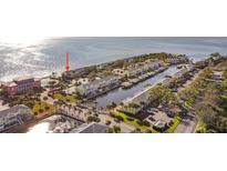 Aerial view of waterfront community with boat slips and pool at 5026 Coquina Key Se Dr # 5026, St Petersburg, FL 33705