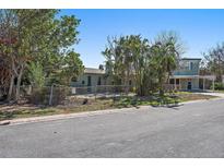 Single story home with a brick facade and a walkway to the front door at 7060 Boca Ciega Dr, St Pete Beach, FL 33706