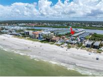 Aerial view of beachfront property, showing location and proximity to beach and other buildings at 19807 Gulf Blvd # 128, Indian Shores, FL 33785