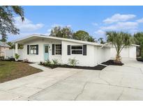 Charming single-story home with updated facade and landscaping at 6317 S Lansdale Cir, Tampa, FL 33616