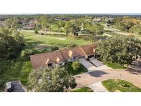 Aerial view of home on golf course community at 5935 Precious View Ct, New Port Richey, FL 34655