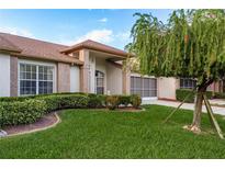 Brick house with a well-manicured lawn, and a two-car garage at 5935 Precious View Ct, New Port Richey, FL 34655