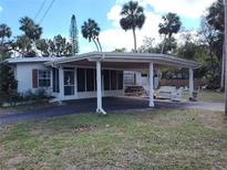 Ranch home with carport, and a spacious yard at 5634 Broadway Ave, New Port Richey, FL 34652
