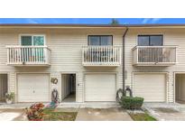 Charming townhouse featuring balconies, neutral siding, and well-kept garages at 6262 93Rd N Ter # 3904, Pinellas Park, FL 33782