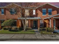 Two-story townhome with a charming front porch and landscaping at 2066 Sun Down Dr 2066 Sun Down Dr, Clearwater, FL 33763