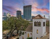 Exterior view of the property and surrounding cityscape at sunset at 132 Mirror Lake N Dr # 404, St Petersburg, FL 33701