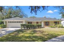 Single-story house with a well-maintained lawn and attached garage at 3722 Village Estates Pl, Tampa, FL 33618