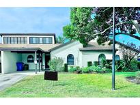 Charming single story home with a well-manicured lawn at 9107 Lingrove Rd, Weeki Wachee, FL 34613