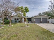 Updated single-story home with a two-car garage and nicely landscaped lawn at 4608 S Shamrock Rd, Tampa, FL 33611