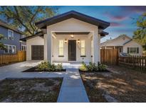 Charming single-Gathering home features modern updates, a garage and a covered front porch at 1565 13Th S St, St Petersburg, FL 33705