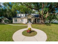 Charming brick home with a spacious lawn and mature trees at 37439 Meridian Ave, Dade City, FL 33525