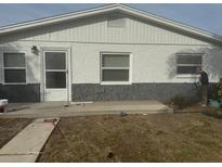 Newly painted house with stone accents and a small front yard at 813 89Th N Ave, St Petersburg, FL 33702