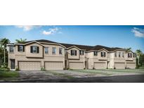 Tan townhouses with dark brown roofs, garages, and paved driveways at 31464 Woodland Race Loop, Wesley Chapel, FL 33545