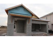 New construction home exterior with stucco siding and a two-car garage at 633 Allora Ave, Nokomis, FL 34275