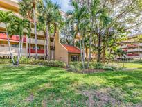 Building exterior showcasing landscaping and entrance at 3062 Eastland Blvd # 302D, Clearwater, FL 33761