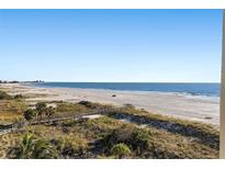 Stunning panoramic view of the ocean and beach from a beachfront property at 12000 Gulf Blvd # 501-W, Treasure Island, FL 33706