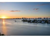 Stunning aerial view of waterfront homes at sunset at 4 Belleview Blvd # 801, Belleair, FL 33756