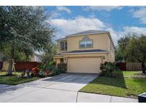 Charming two-story home with a two-car garage, driveway, and a well-maintained lawn and garden at 9703 33Rd E Ave, Palmetto, FL 34221
