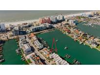 Aerial view of waterfront property with private boat dock at 140 Brightwater Dr # 6, Clearwater Beach, FL 33767