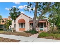Charming Spanish style home with terracotta roof and lush landscaping at 2311 Brevard Ne Rd, St Petersburg, FL 33704