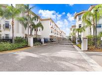 Community entrance with gated access and lush landscaping at 1340 Bayshore Blvd # 407, Dunedin, FL 34698
