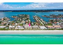 Aerial view showcasing beachfront location and community at 3100 Gulf Blvd # 424, Belleair Beach, FL 33786