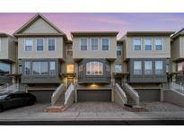 Three-story townhouses with attached garages and stairs at 4338 Spinnaker Cove Ln, Tampa, FL 33615