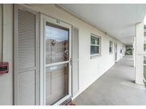 Exterior view of building showing walkway and condo entrance at 19029 Us Highway 19 N # 5-1, Clearwater, FL 33764