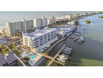 Aerial view of waterfront property, showing building and boat docks at 20001 Gulf Blvd # 501, Indian Shores, FL 33785
