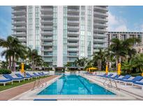Resort-style pool with plenty of lounge chairs and umbrellas at 100 1St N Ave # 1601, St Petersburg, FL 33701