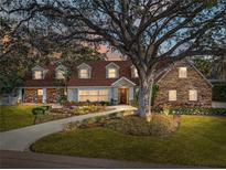 Stunning two-story home with stone accents and a manicured lawn at 307 Harbor View Ln, Largo, FL 33770