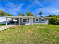 Newly renovated house with carport and fenced backyard at 5111 Eldorado Dr, Tampa, FL 33615