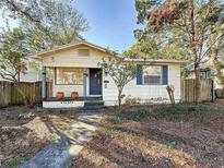 Charming one-story home with a front porch and mature trees at 150 22Nd N Ave, St Petersburg, FL 33704