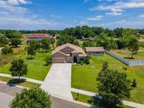 Stunning aerial view of a two-story home with a large yard at 3406 Ranchdale Dr, Plant City, FL 33566