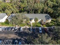 Charming condo building features mature landscaping and convenient parking spaces for residents and guests at 3001 58Th S Ave # 901, St Petersburg, FL 33712