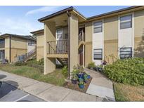 Inviting condo building exterior with well-maintained landscaping at 10199 Sailwinds S Blvd # I-102, Largo, FL 33773