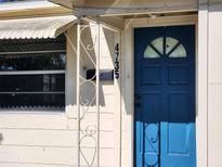 House exterior featuring a blue front door and a white awning at 4735 22Nd N Ave, St Petersburg, FL 33713