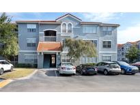 Two-story condo building with parking and landscaping at 18001 Richmond Place Dr # 835, Tampa, FL 33647