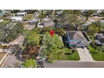Aerial view of a house and surrounding neighborhood at 4704 W Chapin Ave, Tampa, FL 33611