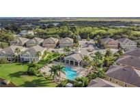 Aerial view of community with pool, clubhouse, and lush landscaping at 7001 Interbay Blvd # 247, Tampa, FL 33616