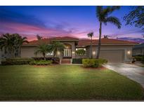 Beautiful home with lush landscaping and a two-car garage at 6000 51St S St, St Petersburg, FL 33715