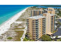 Aerial view of beachfront condo building with ocean and beach views at 880 Mandalay Ave # C1103, Clearwater Beach, FL 33767