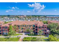 Aerial view of luxury condo building with water access at 2741 Via Cipriani # 930A, Clearwater, FL 33764