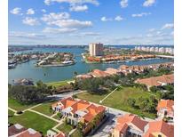 Aerial view of waterfront property with a vacant lot and surrounding homes at 21 Crescent S Pl, St Petersburg, FL 33711