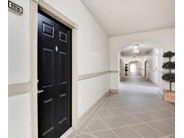 Building hallway with tile floor and access to unit at 501 Knights Run Ave # 2216, Tampa, FL 33602