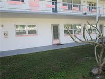 Exterior view of building showing entrance and landscaping at 5876 21St N St # 3, St Petersburg, FL 33714