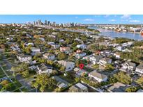 Aerial view showing a house and city skyline in the background at 612 Danube Ave, Tampa, FL 33606