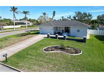 Single-story home with a well-manicured lawn and driveway at 289 Monte Cristo Blvd, St Petersburg, FL 33715